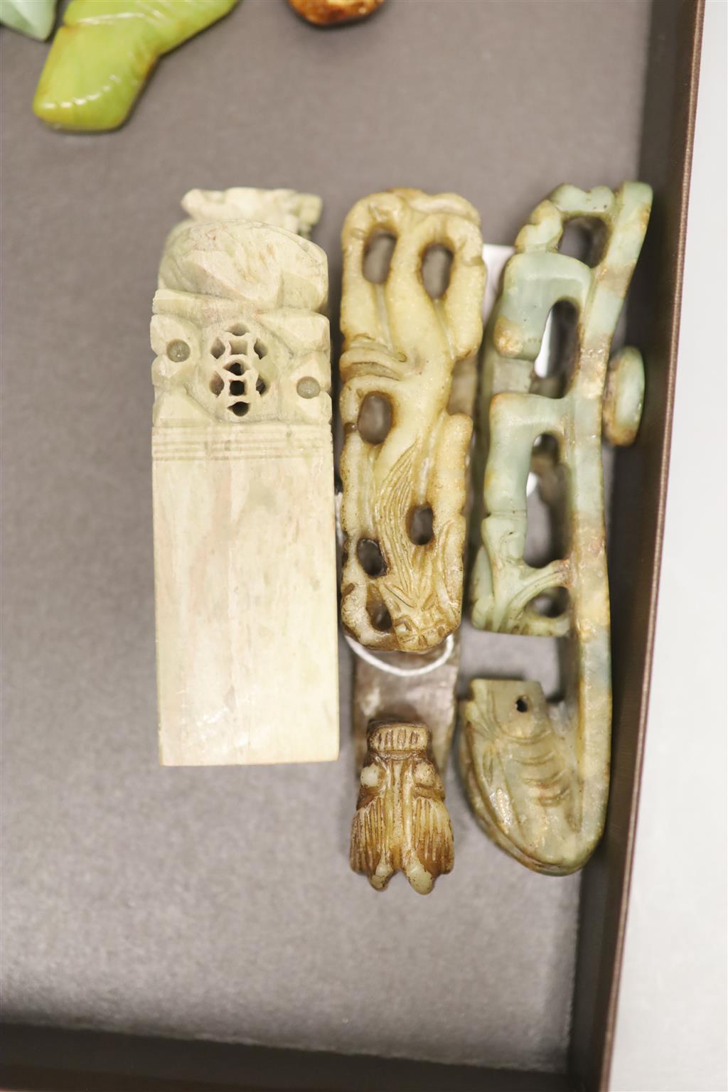 Six Chinese jade and hardstone animal carvings, two dragon belt hooks, a rams head and a soapstone seal, 10cm